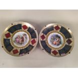 A pair of late 19th Century Schierholz porcelain dishes heavily gilded with central hand painted