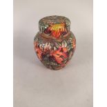 A Moorcroft lidded jar in the Flame of the Forest pattern, dated 97,