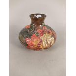A squat Moorcroft Flame of the Forest pattern vase, dated 97,
