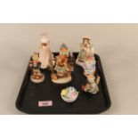 Four Goebel children figures together with a Coalport "Meryl" figurine,