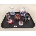 Five assorted glass paperweights including two Caithness examples,