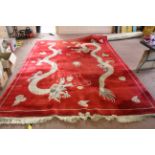 A large Chinese wool red ground carpet,