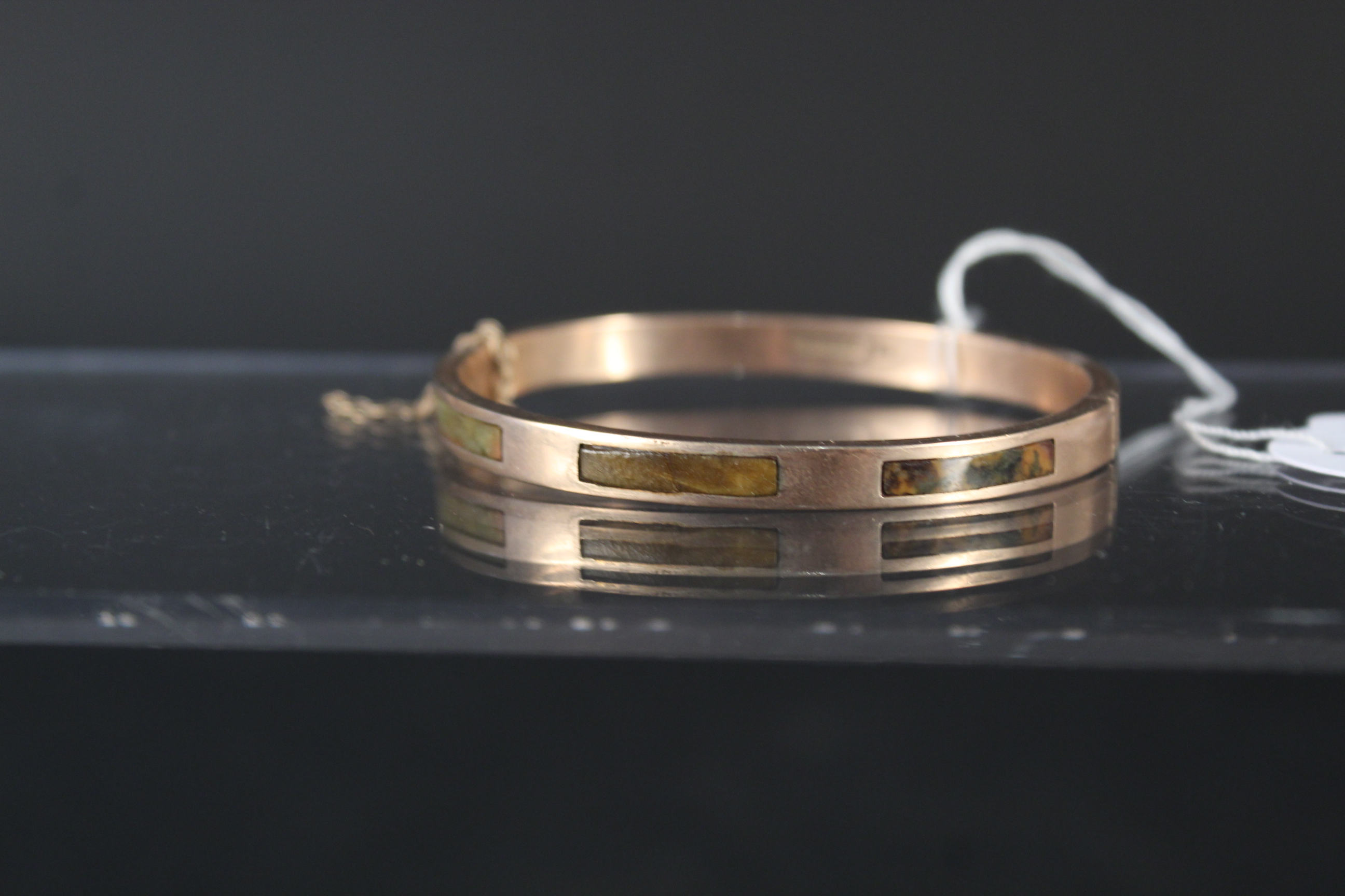 A 9ct gold bangle set with rectangular hardstone panels (as found), - Image 3 of 3