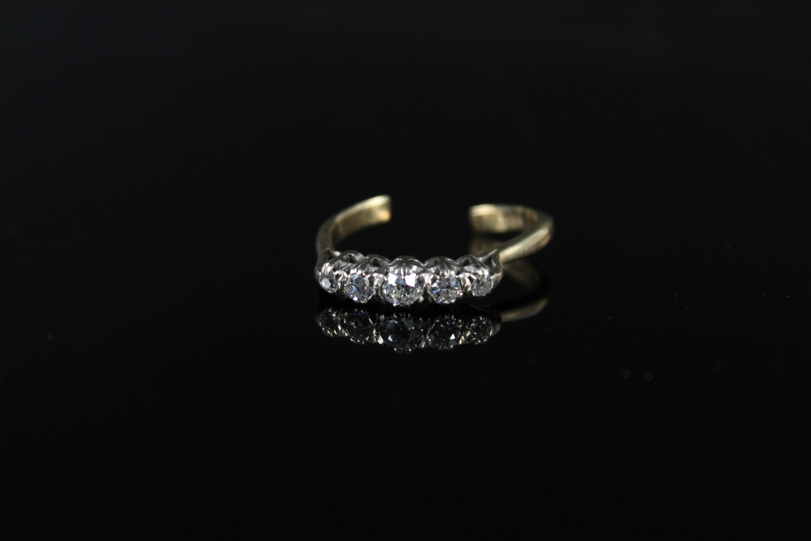 An 18ct gold five stone diamond ring (shank as found),