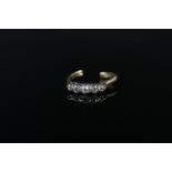 An 18ct gold five stone diamond ring (shank as found),