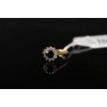 An 18ct gold sapphire and diamond set ring,