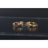 Three rings, one in 9ct gold (as found),