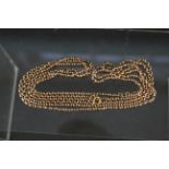 A 9ct gold long guard chain,