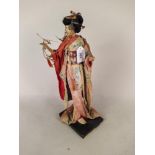 A vintage Japanese Geisha girl figure,