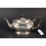 A silver teapot with presentation inscription, hallmarked Sheffield 1919,