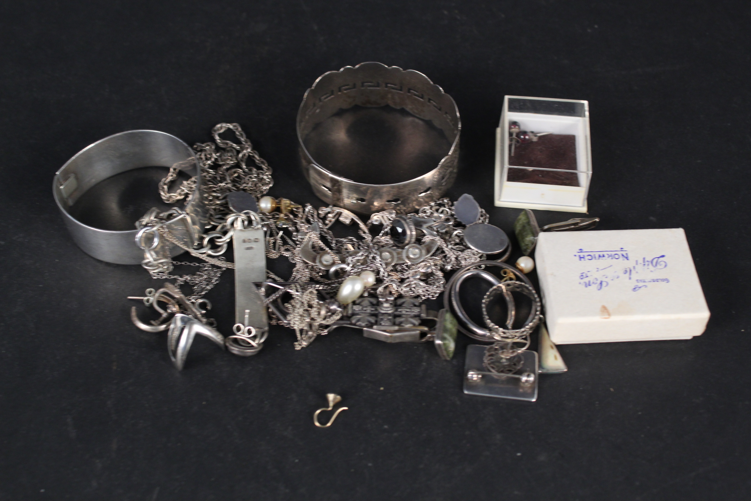 A mixed lot of silver and white metal jewellery including bangles, bracelets, earrings,