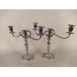 A pair of early 20th Century plated two branch candelabra in the Adam style