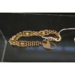 A 9ct gold bracelet with heart shaped padlock clasp, weight approx 10.