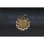 A 1913 half sovereign in 9ct gold pendant mount,