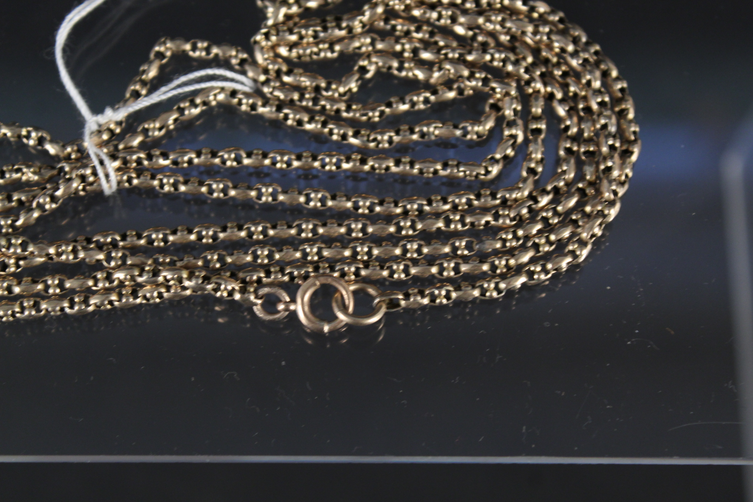 An unmarked yellow metal long guard chain, - Image 2 of 3