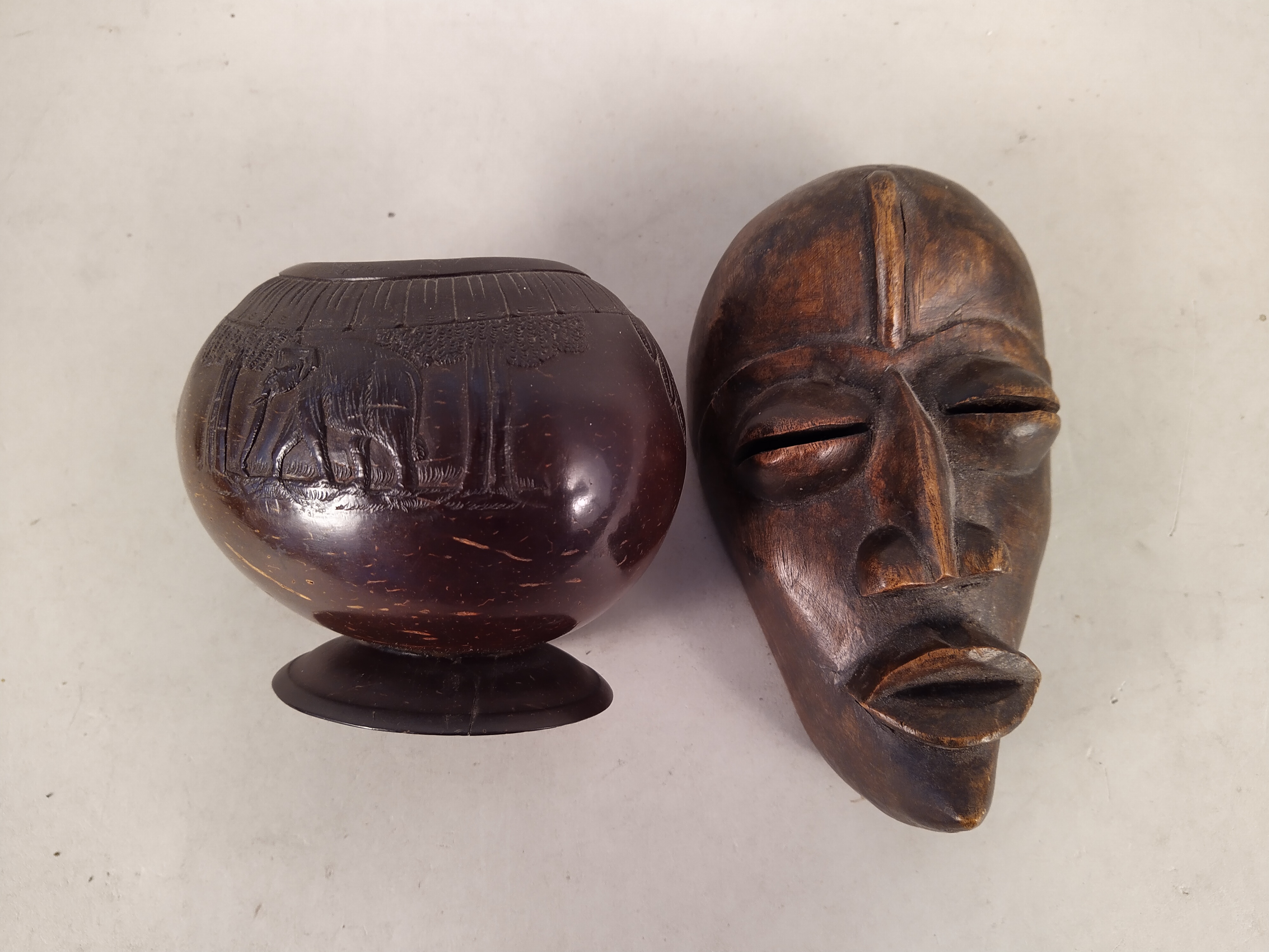 Two African carved wood face masks plus a carved coconut bowl on stand decorated with elephants - Image 2 of 3