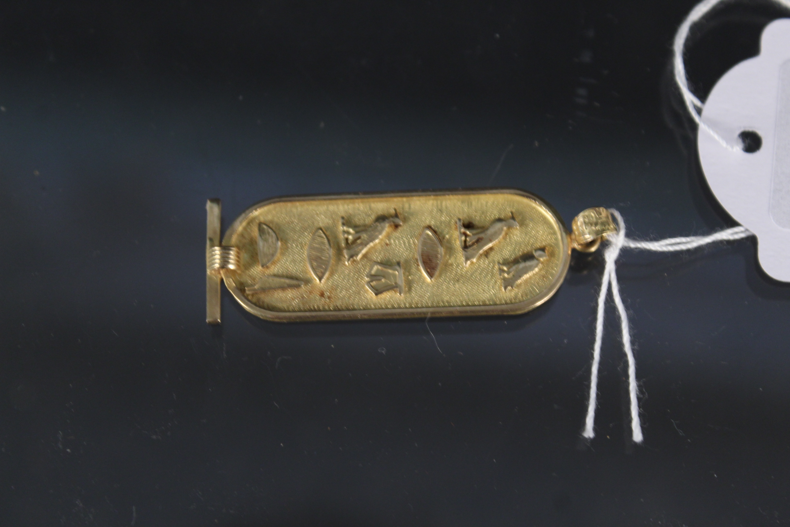 An Egyptian high carat gold pendant, weight approx 4.