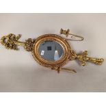 An ornate French style gilded mirror with candle holders,