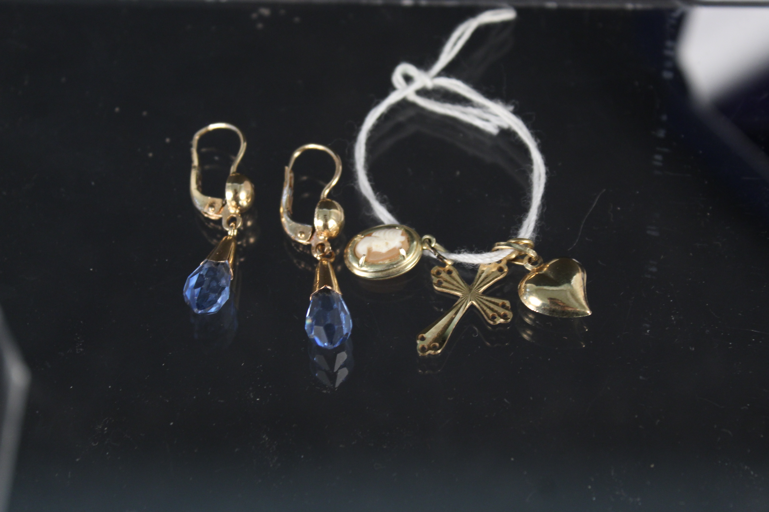 A pair of continental yellow metal earrings marked 750 with faceted blue stone drops together with