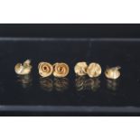 Three pairs of 9ct gold textured design earrings,