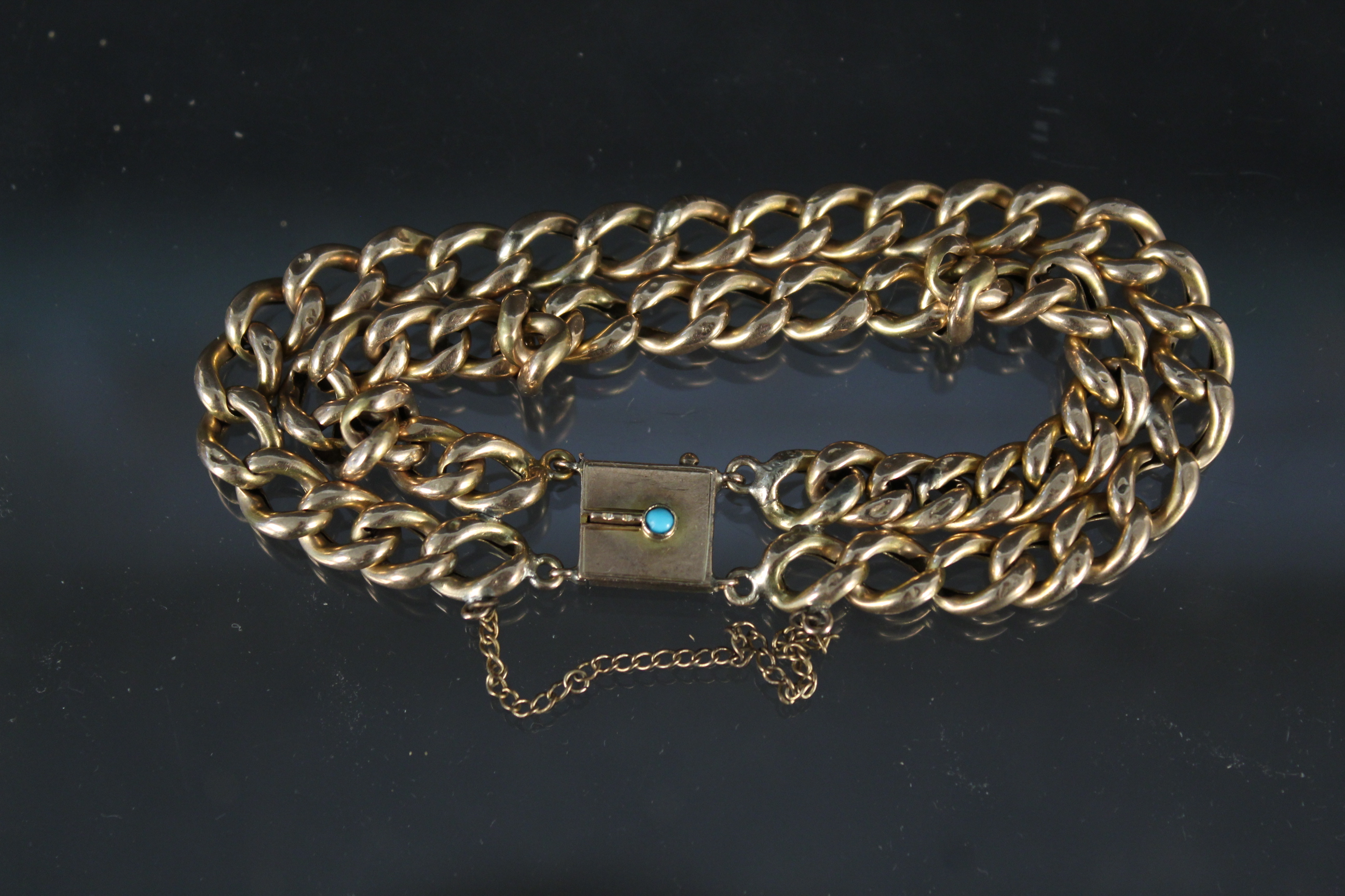 A 9ct gold double row bracelet with turquoise set clasp (possibly converted from a chain) (damage