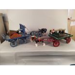 Two ceramic horses with drays plus a small shire and two carts