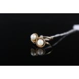 A 9ct gold crossover pearl set ring, size I, weight approx 3.