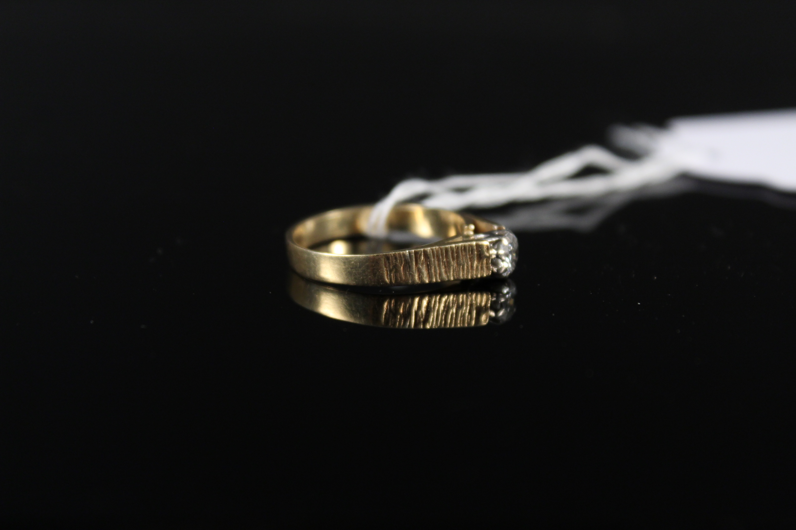 An 18ct gold solitaire ring with bark effect shoulders, size L, weight approx 2. - Image 2 of 3
