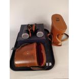 A leather cased pair of binoculars 10x50 by Carton with box plus a pair of Prinz 8x40 binoculars