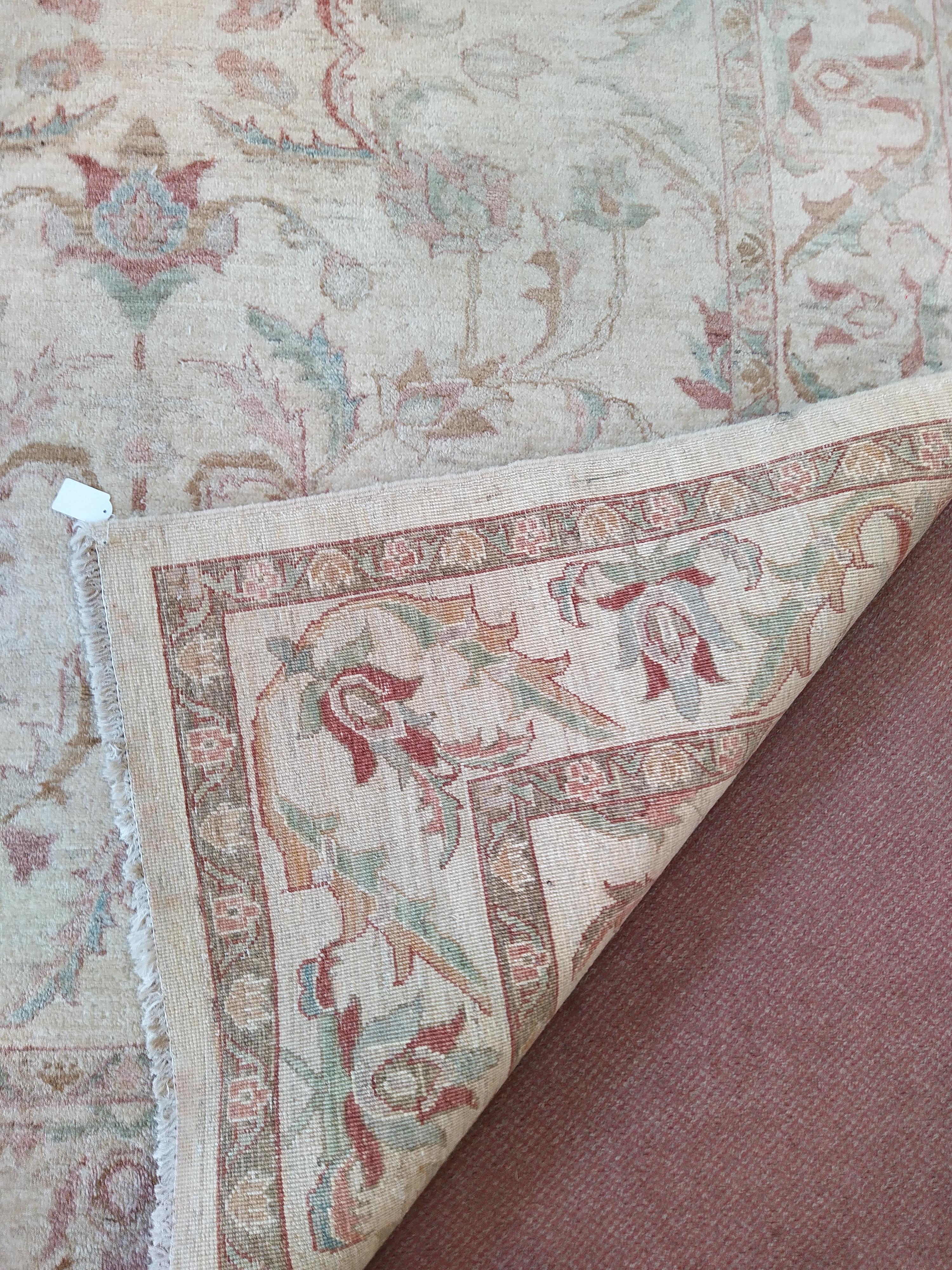 A wool rug with pale floral patterns against a beige ground, - Image 3 of 3