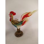 A large coloured glass cockerel, a cut glass ships decanter, a cut glass whisky decanter,