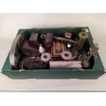 A box of mixed metal wares including candlesticks, a cash tin,