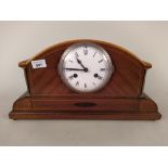 An Edwardian inlaid mahogany striking mantel clock