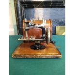 A vintage 'Lead' mini sewing machine in box