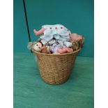 A wicker basket of vintage plastic dolls