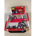 Three boxed Britains 1:32 scale models including 9656 Renault TX16 tractor and baler,