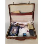 A suitcase of women's Masonic items include regalia, guide books,