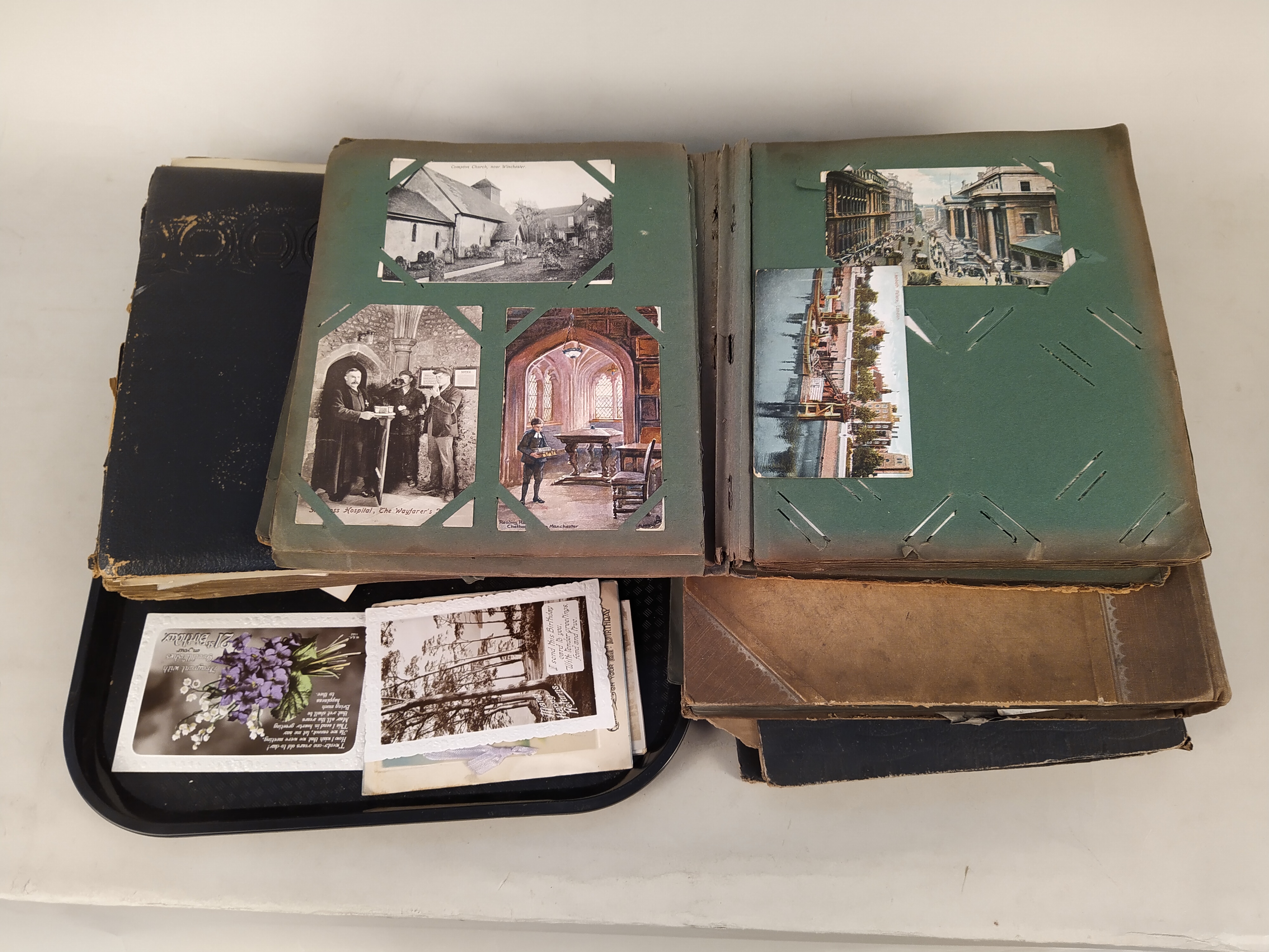 Five early postcard albums, well filled with early 20th Century cards,