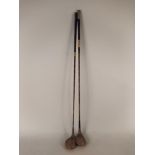 Two hickory shafted golf clubs,