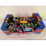 A large box of vintage die cast vehicles including Matchbox, Corgi,