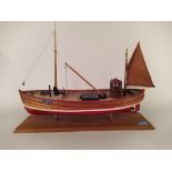 A hand built wooden model of a ship 'Jester AN23' mounted on wood base,