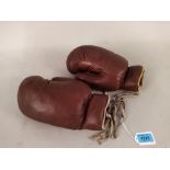 A pair of vintage leather boxing gloves,