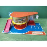 A vintage 1960's S10 garage with wind up car lift