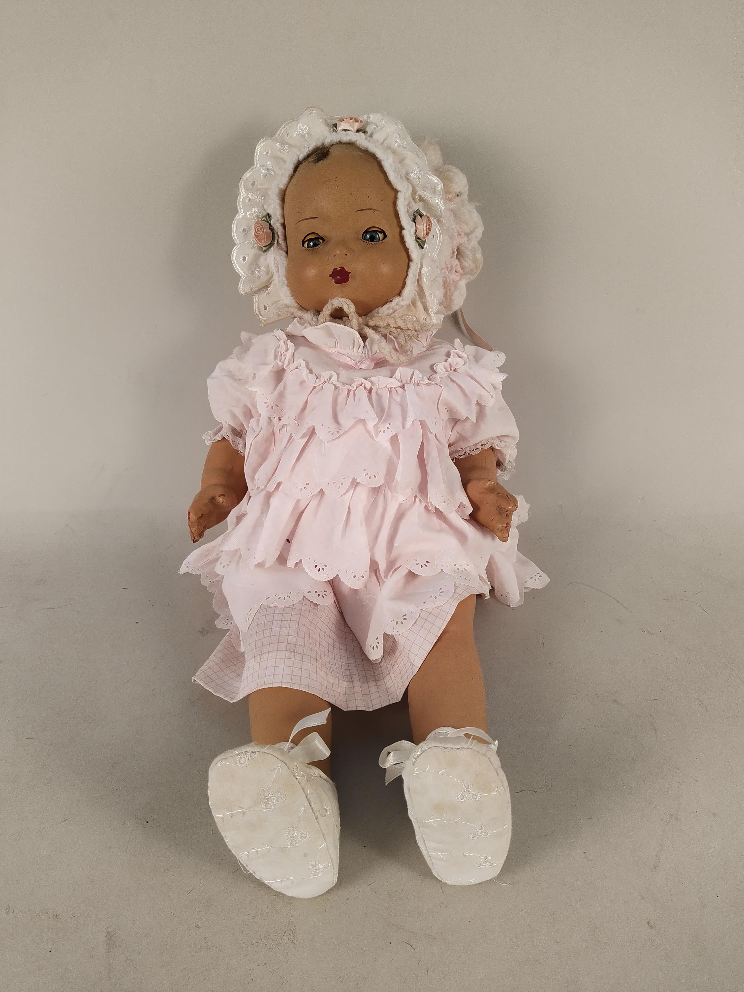 A vintage articulated doll with closing eyes