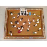 A frame of mainly antique buttons including glass, cut steel,