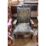 An Edwardian upholstered armchair