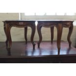 A pair of late 19th Century French walnut foot stools on cabriole legs