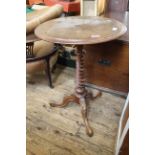 A mid Victorian walnut carved tripod table on spiral column