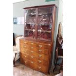 A late George III mahogany secretaire bookcase with associated top