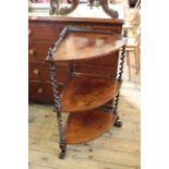 A mid Victorian rosewood three tier corner whatnot on scroll feet